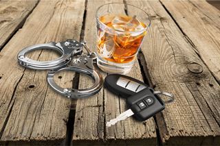 Glenwood Springs DUI Lawyer - handcuffs car keys and a drink