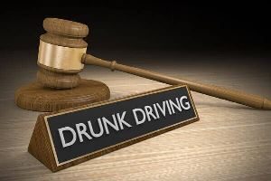 Gavel and drunk driving signage.